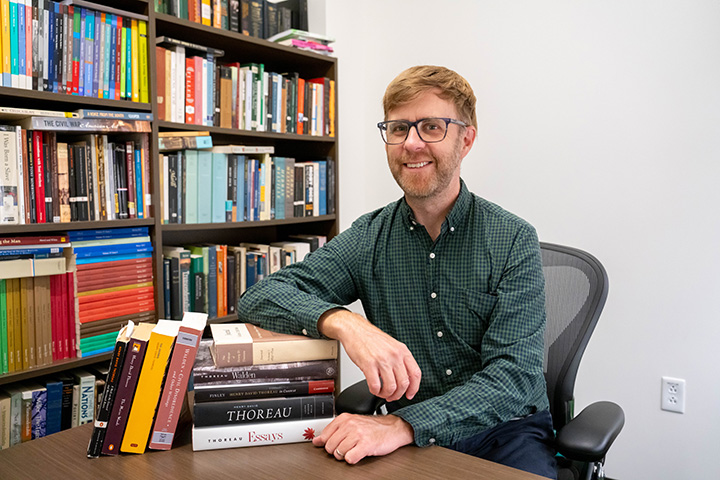 James Finley at Desk with Books