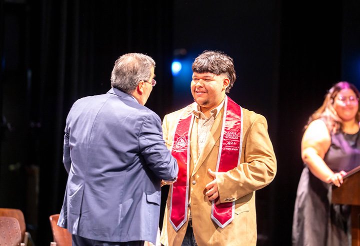 Student Shaking Dr. Ochoa's Hand