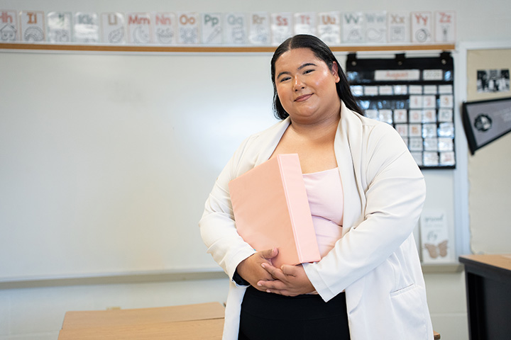 Alyssa Garcia with Pink Binder