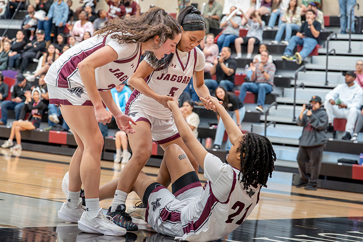 Jaguar Women's Basketball Players Helping Opposing Player Up