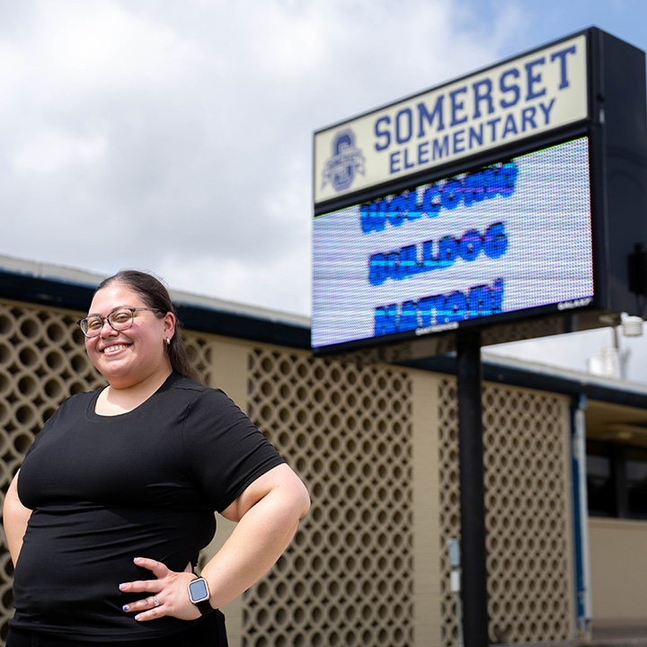 Julie Mello in Front of Somerset Elementary Sign