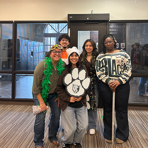 Student Life Staff Holding Jaguar Paw