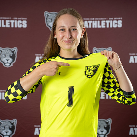 Womens Soccer Goalie Pointing to General on Jersey